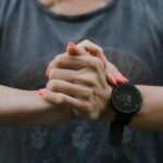 Athlete wearing a smart fitness wearable tracking performance